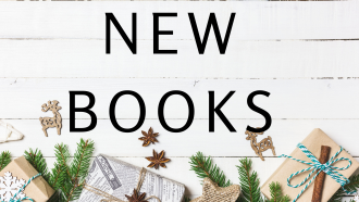 whitewashed wood with green pine and books with red accents